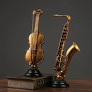 Ornamento Decorativo de Resina Violino e Saxofone Dourado Offertaza